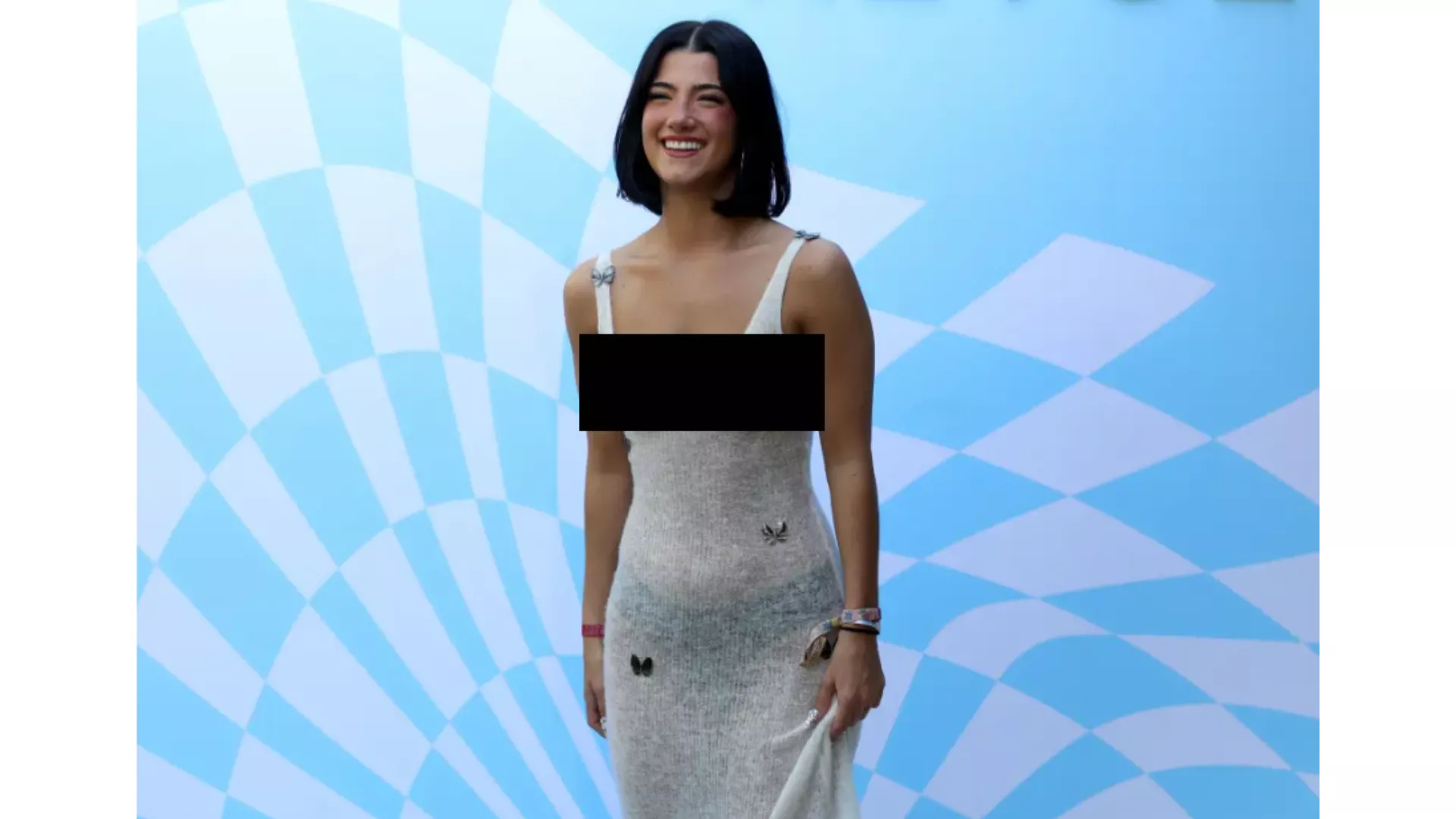 charli smiling while posing in a white knit dress with butterflies at coachella photo chad salvador shutterstock charli smiling while posing in a white knit dress with butterflies at coachella photo chad salvador shutterstock