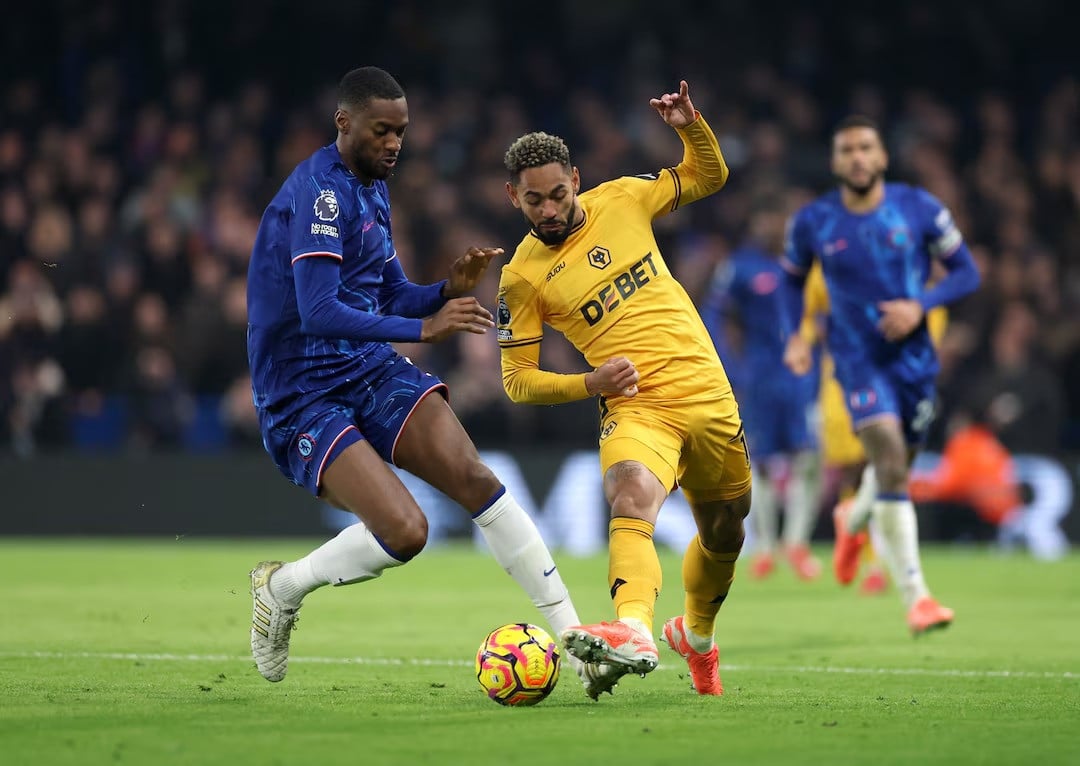 chelsea s marc cucurella in action with wolverhampton wanderers emmanuel agbadou in premier league chelsea vs wolverhampton wanderers match at stamford bridge london on january 20 2025 photo reuters