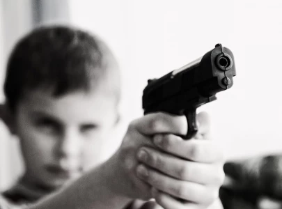 child killed while playing with pistol