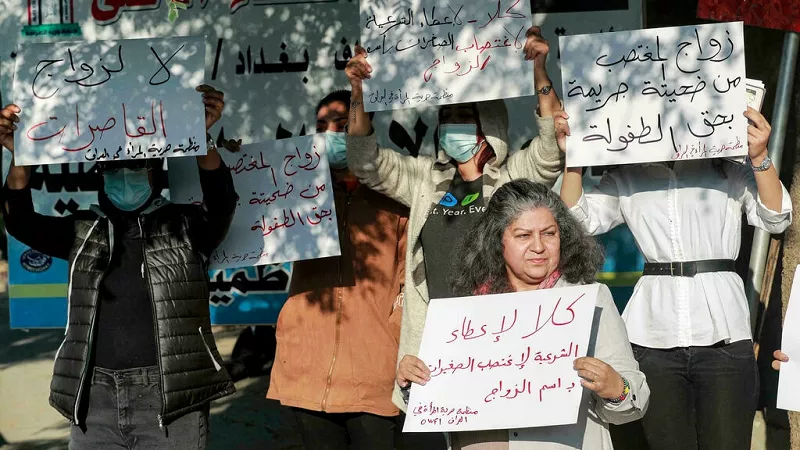 activists demonstrate outside a court in iraq s capital baghdad in protest against the legalisation of a marriage contract for a 12 year old girl photo afp activists demonstrate outside a court in iraq s capital baghdad in protest against the legalisation of a marriage contract for a 12 year old girl photo afp