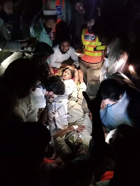 children receive first aid after they were rescued from the stranded chairlift in battagram pakistan august 22 2023 photo reuters