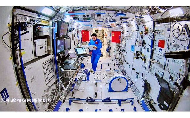 chinese astronaut tang hongbo of the shenzhou 12 mission works inside the core module tianhe of the chinese space station as his colleagues conduct extravehicular activities outside the space station photo reuters