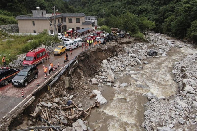 the aftermath of a mudslide in weiziping village of luanzhen township on the outskirts of chang an district xi an of northwestern china s shaanxi province on saturday aug 12 2023 photo ap the aftermath of a mudslide in weiziping village of luanzhen township on the outskirts of chang an district xi an of northwestern china s shaanxi province on saturday aug 12 2023 photo ap