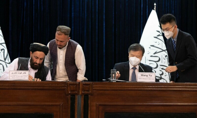 taliban administration s acting minister for disaster management at a rare press conference with chinese ambassador wang yu in kabul photo afp taliban administration s acting minister for disaster management at a rare press conference with chinese ambassador wang yu in kabul photo afp