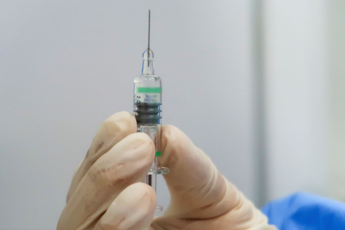 a nurse holds a syringe containing a coronavirus disease covid 19 vaccine made by the beijing institute of biological products a unit of sinopharm subsidiary china national biotec group cnbg at a vaccination center during a government organized visit in beijing china april 15 2021 reuters