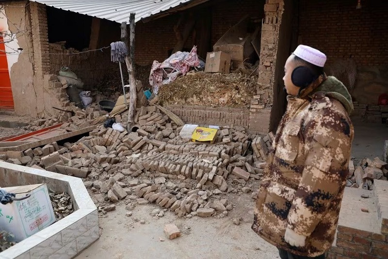 a man stands at his damaged house at sibuzi village following the earthquake in jishishan county gansu province china december 21 2023 photo reuters