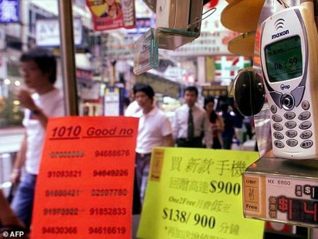 people walk past a mobile phone shop displaying lucky telephone numbers for sale in hong kong many asian cultures consider certain numbers such as eight as good fortune photo afp file people walk past a mobile phone shop displaying lucky telephone numbers for sale in hong kong many asian cultures consider certain numbers such as eight as good fortune photo afp file
