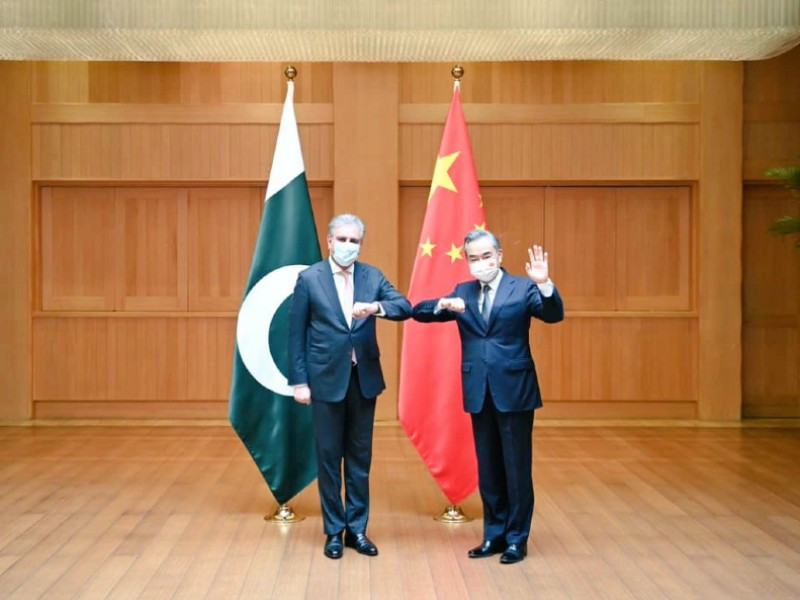 foreign minister shah mahmood qureshi with china s state councillor and foreign minister wang yi photo twitter smqureshipti