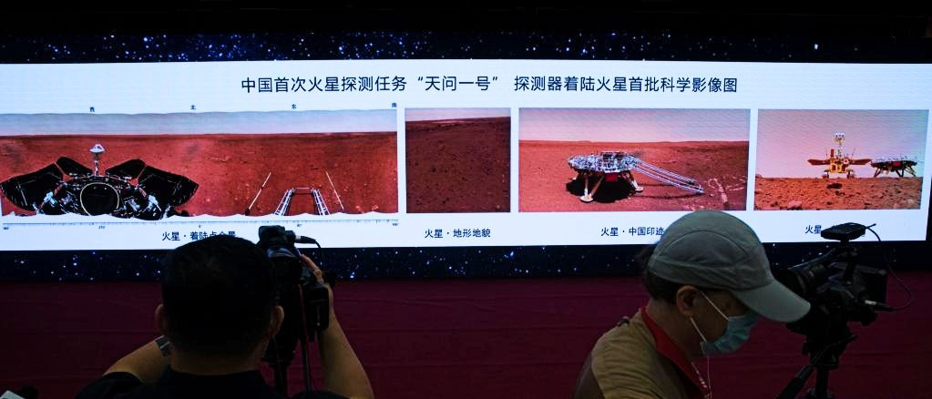 Journalists work at the ceremony during which new images taken by China's first Mars rover Zhurong are unveiled in Beijing, capital of China, June 11, 2021. PHOTO: XINHUA