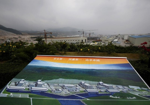 an artist impression of taishan nuclear power plant to be operated by china guangdong nuclear power cgn is displayed on a viewing platform overlooking the construction site in taishan guangdong province october 17 2013 photo reuters