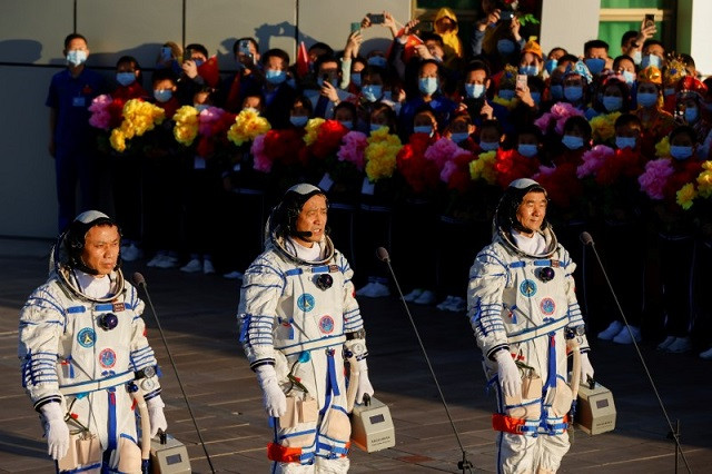 Chinese astronauts Tang Hongbo, Nie Haisheng and Liu Boming speak before the launch of the Long March-2F Y12 rocket, carrying the Shenzhou-12 spacecraft and the three astronauts, from Jiuquan Satellite Launch Center for China's first manned mission to build its space station, near Jiuquan, Gansu province, China June 17, 2021. PHOTO: REUTERS