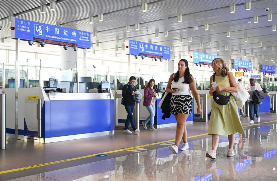 foreign tourists prepare to go sightseeing after completing passenger clearance procedures in north china s tianjin municipality on april 7 2024 file photo xinhua