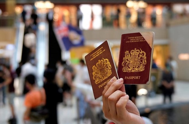 a pro democracy demonstrator holds british national overseas bno passports during a protest against new national security legislation in hong kong china june 1 2020 photo reuters