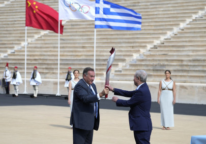 greece hands over olympic flame to beijing 2022 hosts greece hands over olympic flame to beijing 2022 hosts
