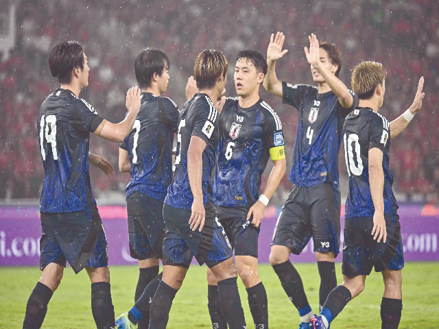 chinese players celebrate as they rejuvenate their world cup qualification hopes with a last gasp 1 0 win over bahrain in riffa thanks to a goal scored by zhang yuning photo afp