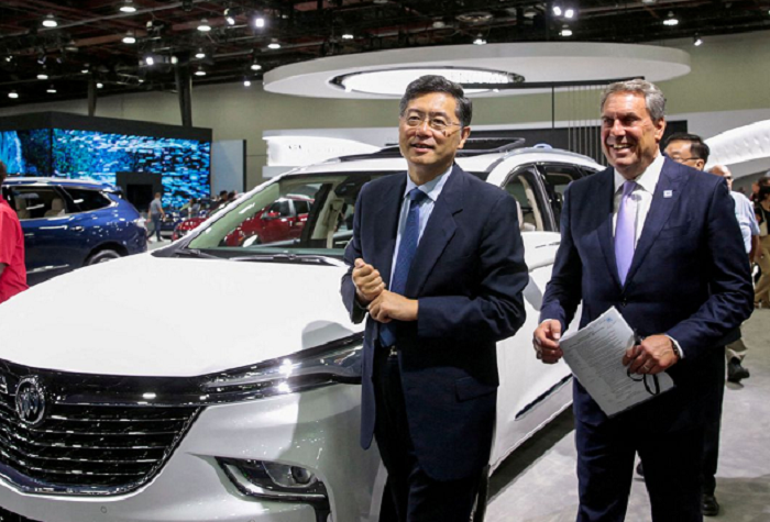 general motors president mark reuss r and chinese ambassador to the us qin gang walk together during a media day of the north american international auto show in detroit michigan u s september 14 2022 photo reuters