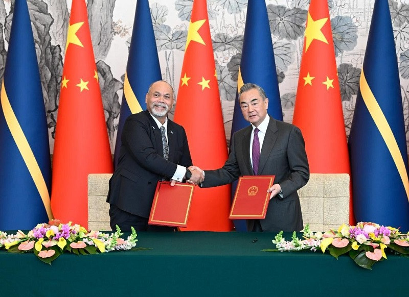 chinese foreign minister wang yi holds talks with nauru s minister for foreign affairs and trade lionel aingimea in beijing china jan 24 2024 photo xinhua