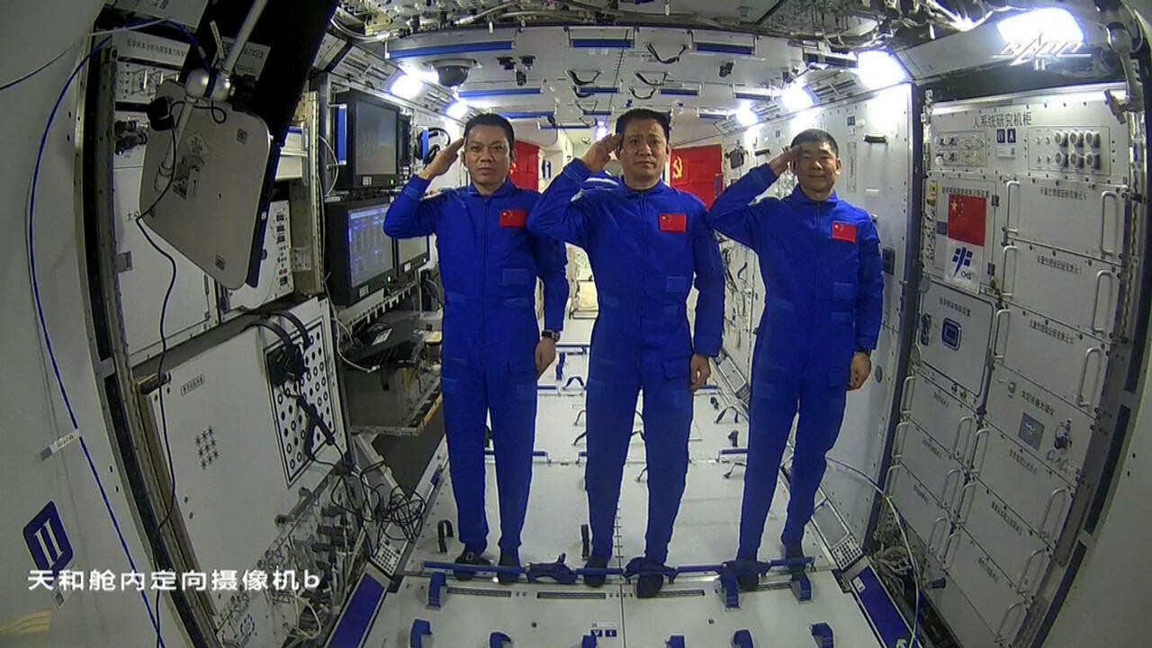 chinese astronauts tang hongbo l nie haisheng c and liu boming r are the first crew on the nation s new space station photo afp file