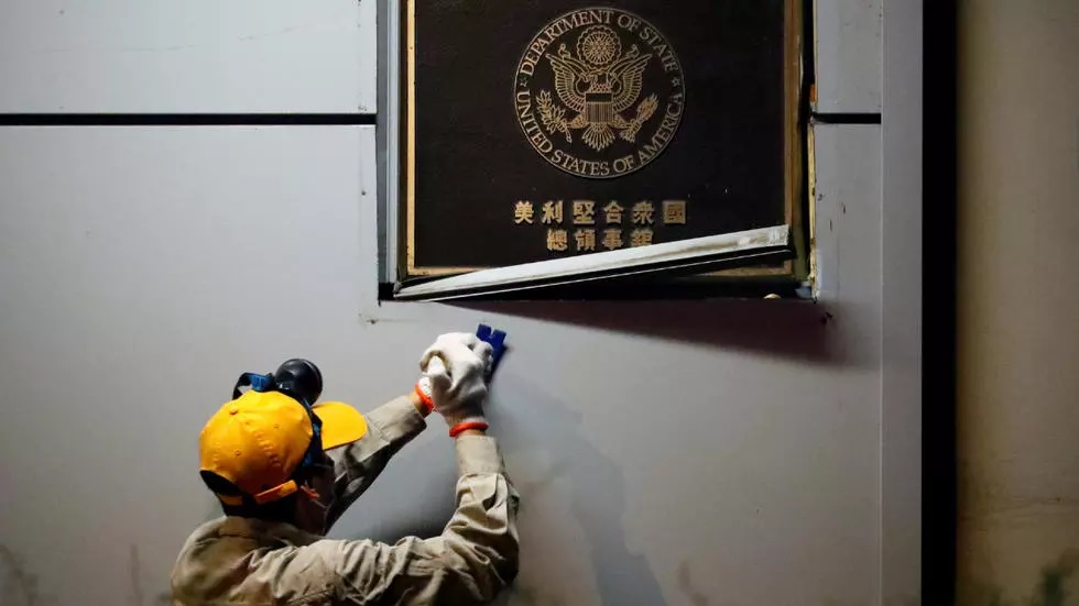 a man works to remove the u s consulate plaque at the u s consulate general in chengdu sichuan province china july 26 2020 photo reuters