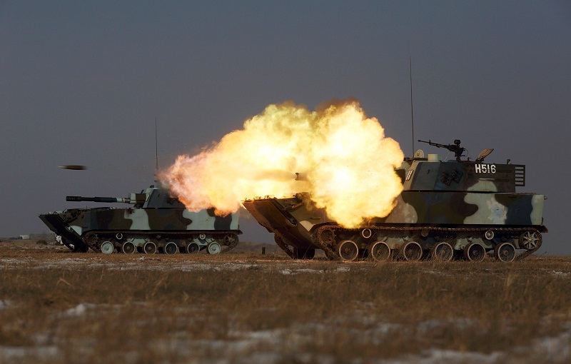 A tank of the People's Liberation Army Navy Marine Corps fires during a military drill at a base in China’s Jilin province in 2015. PHOTO: REUTERS