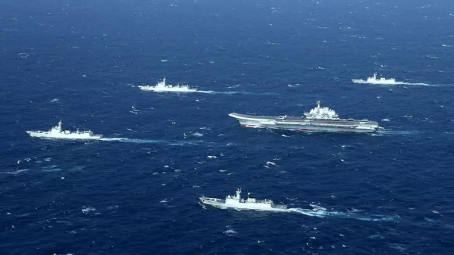 chinese navy ships including the aircraft carrier liaoning during military drills in the south china sea photo afp chinese navy ships including the aircraft carrier liaoning during military drills in the south china sea photo afp