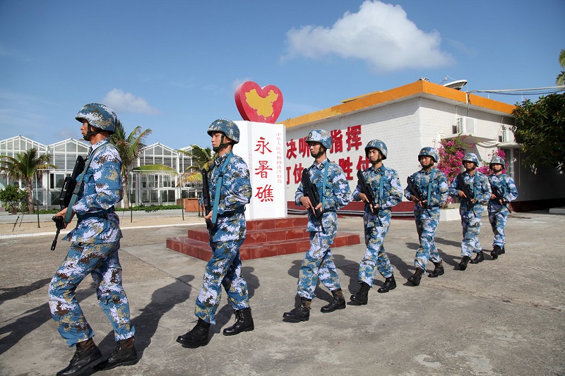 Members of the Chinese navy patrol at Fiery Cross Reef in the Spratly Islands in 2016. China refers to this contested group of islands and reefs in the South China Sea as the Nansha Islands. PHOTO: REUTERS