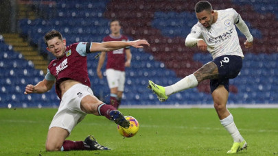 slick man city sink burnley to move three points clear