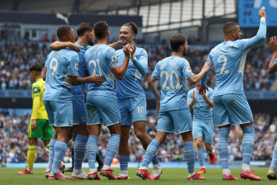 man city cruise past norwich liverpool beat burnley man city cruise past norwich liverpool beat burnley