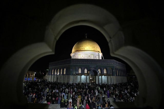 palestinians pray in front of the dome of the rock on laylat al qadr during the holy month of ramazan at the compound that houses al aqsa mosque known to muslims as noble sanctuary and to jews as temple mount in jerusalem s old city may 8 2021 photo reuters