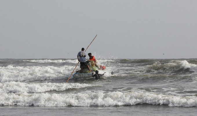 fisherman with a makeshift raft leave for a catch in the arabian sea near clifton beach in karachi pakistan june 7 2023 photo reuters