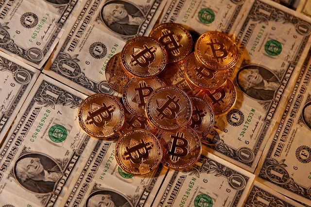 representations of virtual currency bitcoin and us dollar banknotes are seen in this picture illustration taken january 27 2020 photo reuters