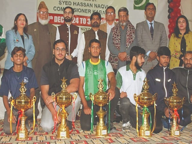 additional commissioner syed ghaznfar ali shah is seen with victorious boys tt and badminton players photo app