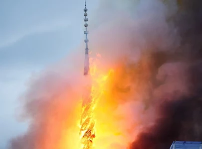 copenhagen fire spire collapses as historic stock exchange engulfed by flames
