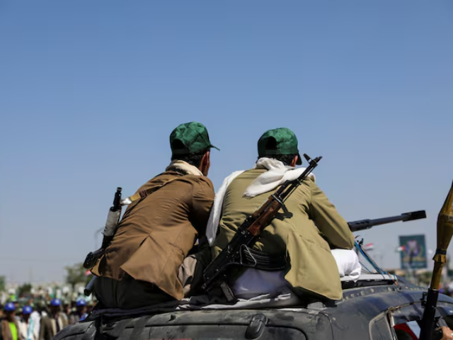 houthi mobilized fighters ride atop a car in sanaa yemen september 21 2024 reuters