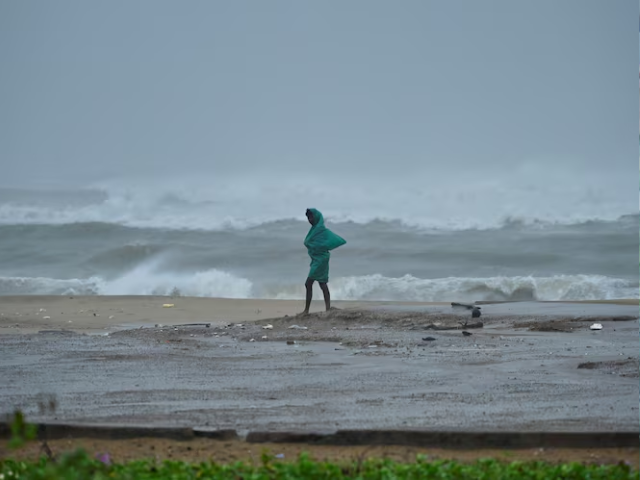 a man walks along the neelankarai beach during high tide before cyclone fengal approaches in chennai india november 30 2024 reuters riya mariyam r