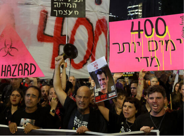 israelis demanding the government do more to enable the return of hostages held by hamas in gaza since its october 7 2023 invasion and massacre in southern israel attend a rally in tel aviv on november 9 2024 marking 400 days since the hamas attack and the abduction of the hostages the placard on the right reads 400 days too many jack guez afp