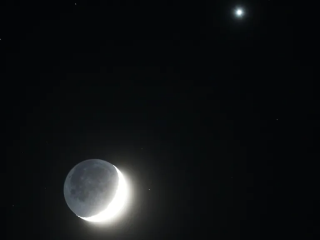 in the uk s whitley bay a shining waxing crescent moon glows with venus to the right pa media