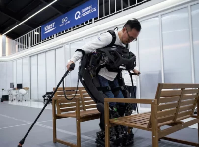 south korean team creates iron man robot to assist paraplegics in walking