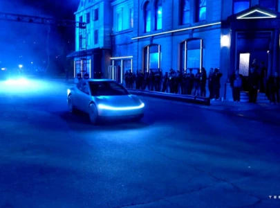 tesla s elon musk debuts futuristic robotaxi and robovan