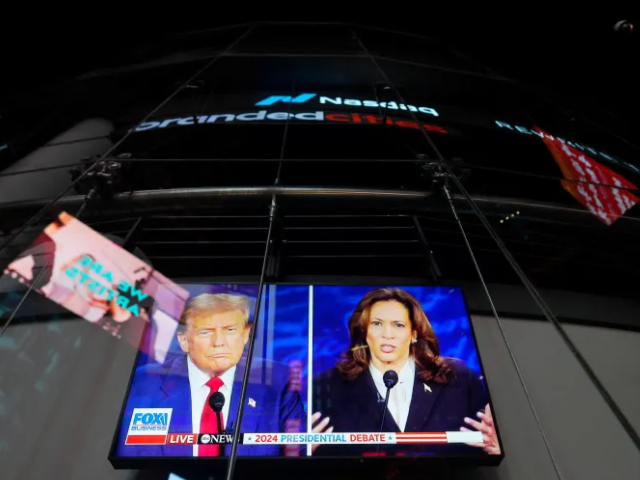 a screen shows the presidential debate between republican nominee donald trump and democratic nominee kamala harris outside the nasdaq marketsite file adam gray reuters