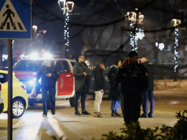 Police and security personnel stand on a street in front of a firetruck near the scene scene where a gunman opened fire at a restaurant and killed several people in Cetinje, Montenegro, January 1, 2025. REUTERS/Stevo Vasiljevic