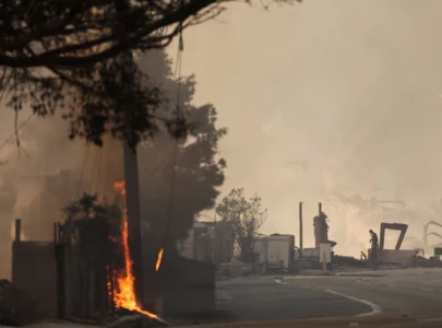 emergency crews respond to reports of people on fire in malibu amid l a wildfires