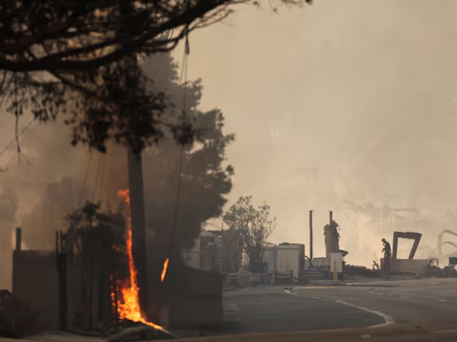 photo a man inspects a smouldering beachfront home along the road to malibu as powerful winds fueling devastating wildfires in the los angeles area force people to evacuate california u s january 8 2025 reuters mike blake