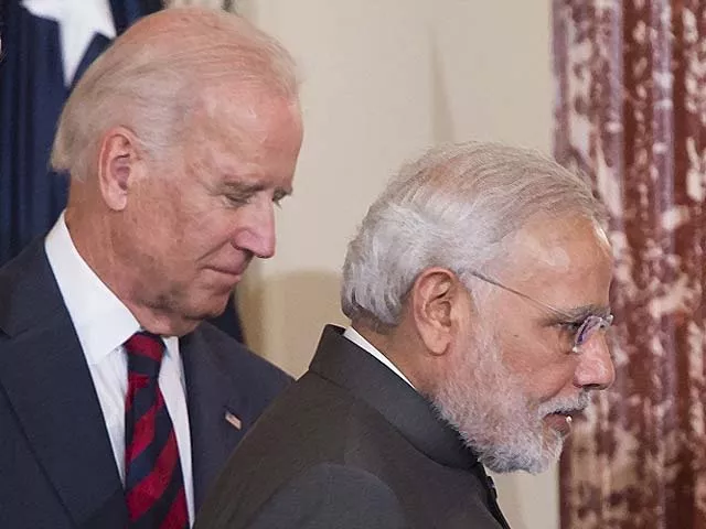 narendra modi walks alongside joe biden photo afp narendra modi walks alongside joe biden photo afp