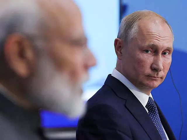 vladimir putin listens to narendra modi at the eastern economic forum photo afp vladimir putin listens to narendra modi at the eastern economic forum photo afp