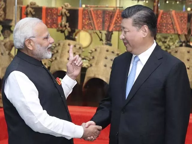 xi jinping shakes hands with narendra modi photo afp xi jinping shakes hands with narendra modi photo afp