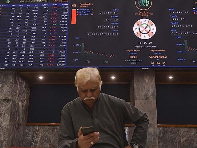 a stockbroker during a trading session at the pakistan stock exchange in karachi photo afp