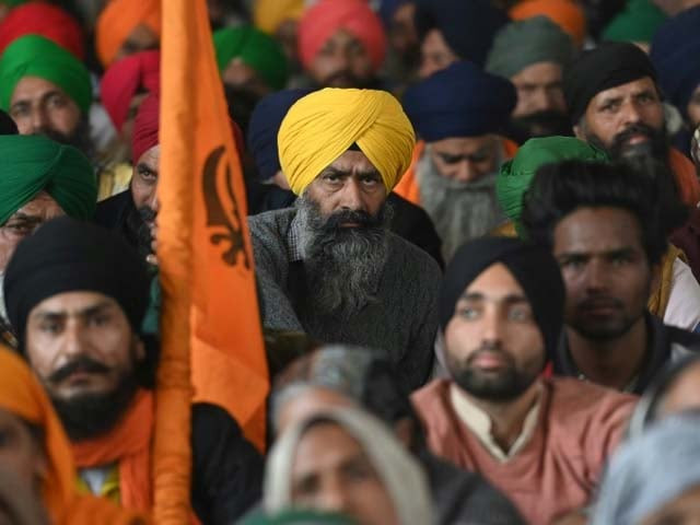 farmers listen to a speaker during a protest against recent agricultural reforms photo afp