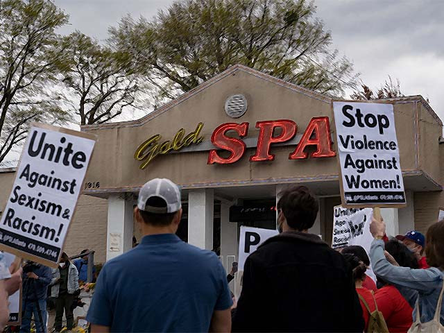 activists demonstrate outside gold spa following tuesday night s shooting photo afp