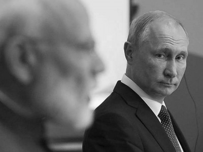 vladimir putin listens to narendra modi at the eastern economic forum photo afp
